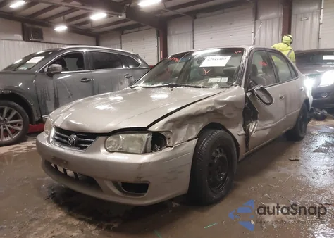 2001 Toyota Corolla Le z USA, uszkodzony, nr VIN 2T1BR12E61C453995